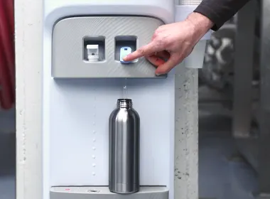Filling a bottle of water from the water cooler
