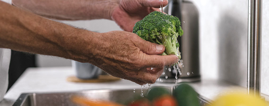 Person washing Broccoli
