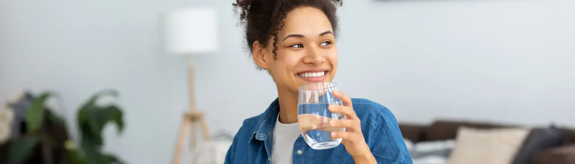 woman drinking a glass of water