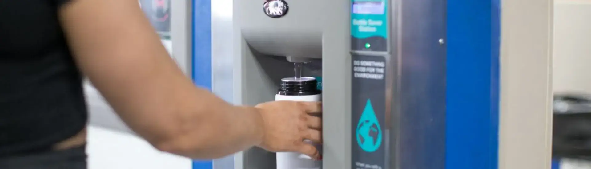 reusable bottle at refill station