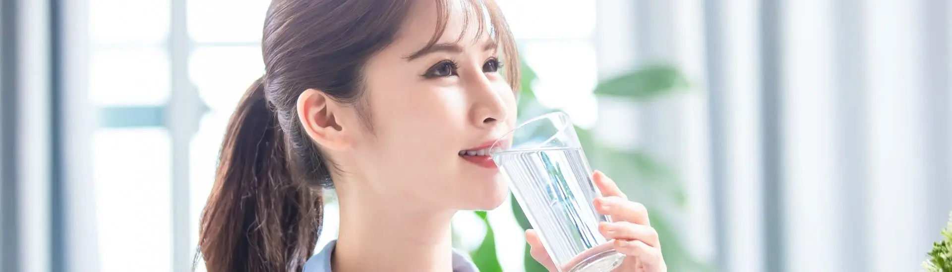 woman drinking glass of water