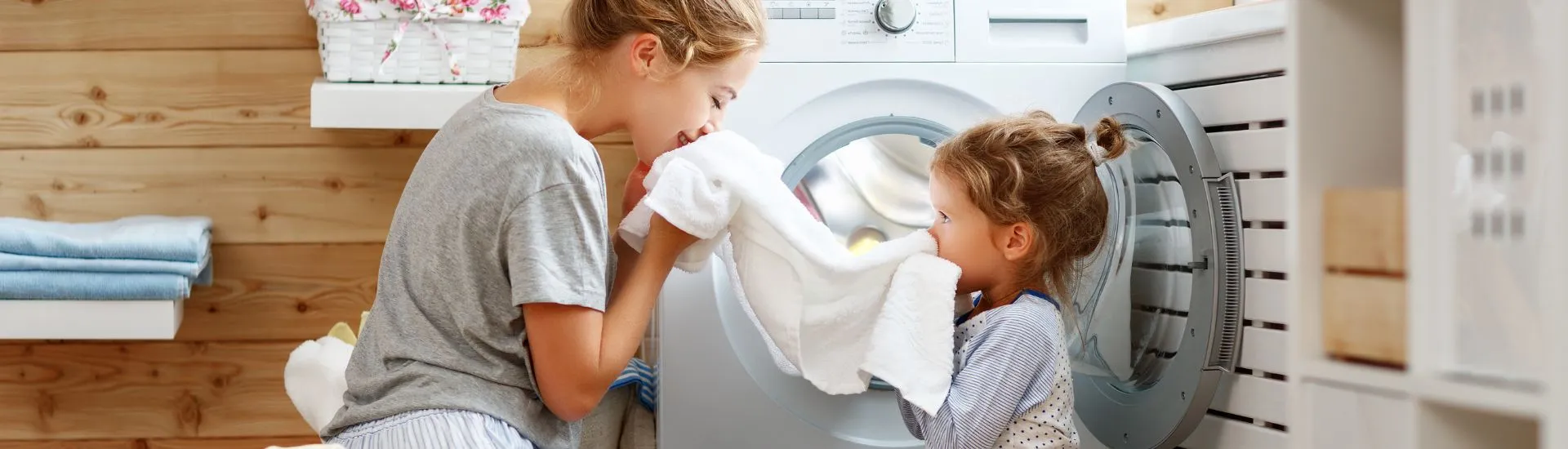 mother and daughter unloading washing machine