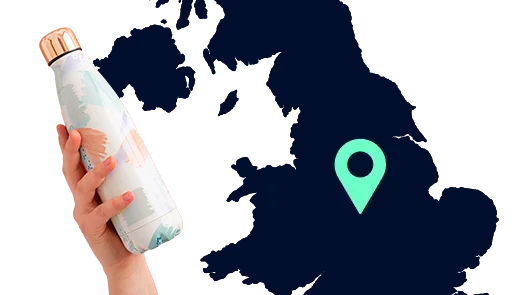 Hand holding refillable bottle with map background