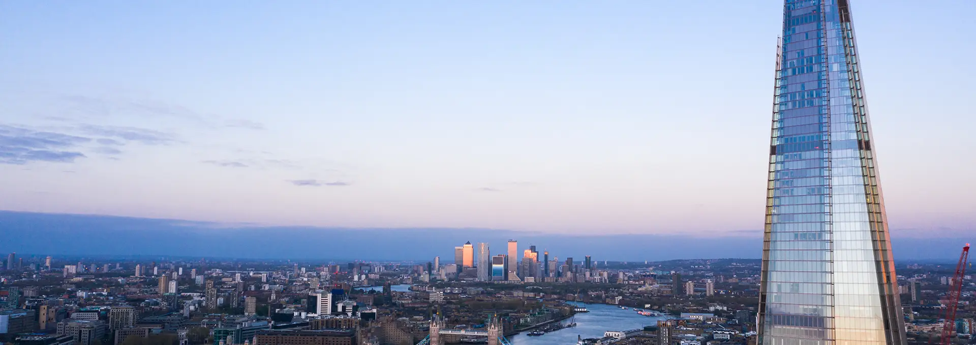 Wide cityscape of London showing a mix of modern and historic buildings.