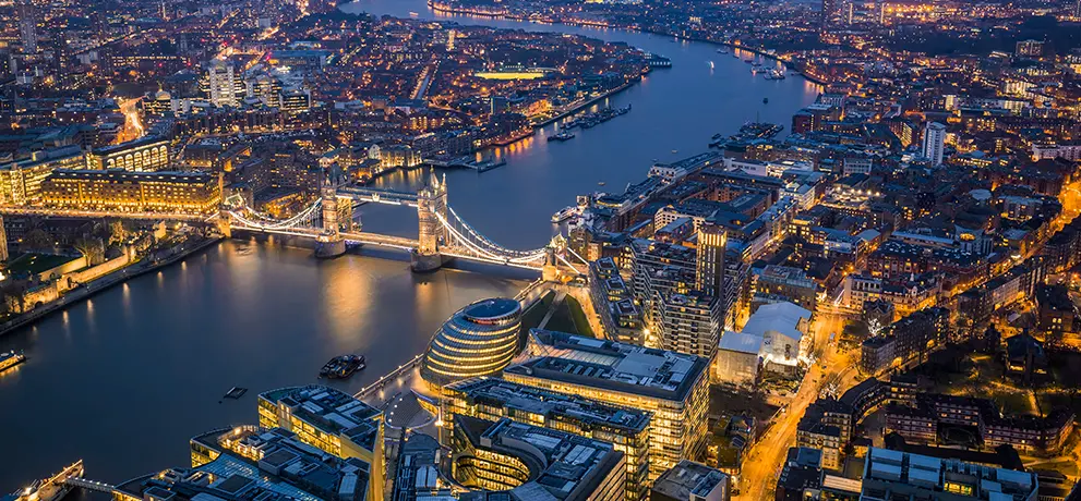 Wide cityscape of London showing a mix of modern and historic buildings.