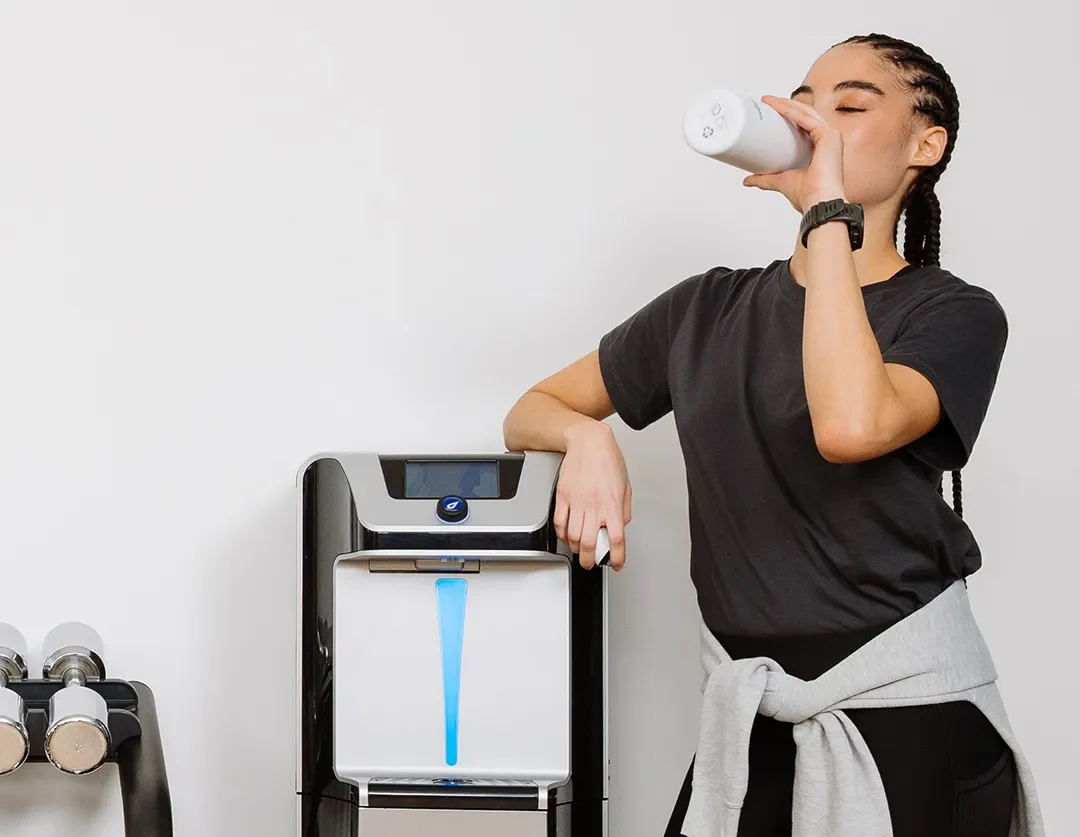 Woman drinking from a water bottle